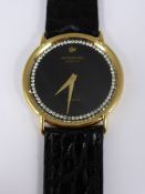 A Gentleman's Raymond Weil Quartz Wrist Watch, the watch 18 k gold plated.