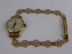 A Lady's Gold Plated Hamilton Wrist Watch. The watch having a silvered dial on a 9 crt hallmark