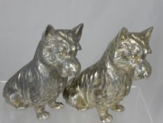 A Pair of White Metal West Highland Terriers, together with two Dachshund and a Schnauzer. (5)