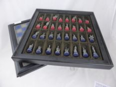 A Franklin Mint Pewter Chess Set, with certificates.