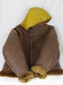 A WWII Coastal Command Leather Flying Jacket, with yellow hood, believed to be worn by a tail gunner