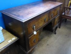 A Victorian mahogany kneehole dressing table having two drawers to the top with two small deep