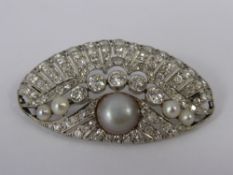 An Art Deco 18 ct White Gold Diamond and Pearl Brooch, the shell form brooch having a feathered