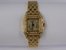 A Lady's Cartier Panthere 18 ct Yellow Gold and Diamond Set Quartz Wrist Watch. The watch having a