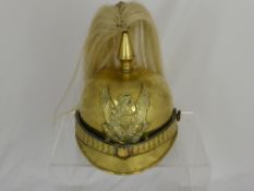 An United States Circa 1900 Brass Marines Parade Helmet, the helmet worn by Officer Cadets at the