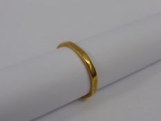 A 22 ct Hallmark Wedding Band, size O, mm W. Wilkinson Ltd. The wedding band having floral