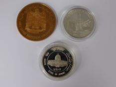 Two Solid Silver Proof Coins. Two and Five Dinars, together with an Abu Dhabi National Oil Company