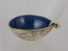 Royce McGlashen MBE, A pottery Scroll bowl of leaf form with high blue glaze and naturalistic