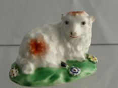 A Miniature18th Century Derby Porcelain Figure, depicting a recumbent ewe, approx 5 x 4.2 cms