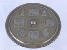 An Oriental Round Brass Plaque, the plaque decorated with figures and character marks.