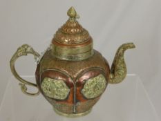 Two Middle Eastern Copper and Brass Teapots.