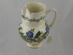 A circa 1930's Hungarian Faience Jug, the vase decorated with blue and pink floral garland