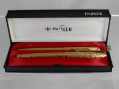 A Set of Gold Plated Parker Pens, including a fountain pen and a ball point pen with a bark