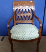 A Mahogany Armchair, of decorative design, with an ornate back, arms partly reeded and splayed