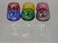 Six cut glass hock glasses, various colours.