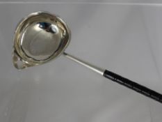 A George III Silver Brandy Ladle, having a pouring bowl, London hallmark dated 1782, m.m rubbed,