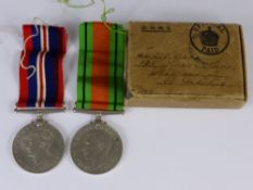 A Set of WWII Medals, including the Defence medal, the 1939-1945 medal together in the original