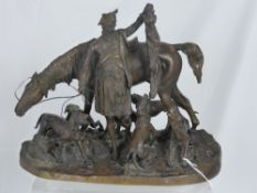 A Bronze Figure Group, depicting a Scottish Huntsman victorious in the hunt, with fox and hunting