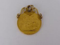 A Victorian Sovereign in a gold mount, dated 1887 together with some loose gold links.