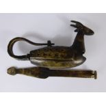 A Middle Eastern Brass Chest Lock in the form of a horned animal.