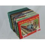 Twelve Vintage Thomas the Tank Engine Books, some with the original covers.