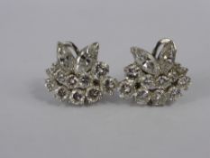 A Pair of Lady's 18 ct White Gold and Diamond Ear Clips. The ear clips being in the form of