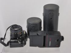 A Minolta Camera Model D2985 X700 MPS, together with two lens including a 52 mm and a Macro, in