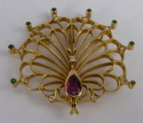 An 18 carat Stylized Ruby, Diamond and Emerald Peacock Brooch, the brooch having tear shaped ruby (6