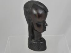 An Iron Wood African Tribal Carving of a lady's bust, approx. 23 cms. in height.