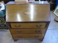 An Edwardian Mahogany Bureau, the interior of the desk fitted with pigeon holes and small drawer,