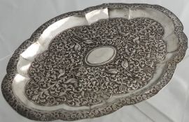 A 19th Century Persian Silver Oval Dish, the dish embossed with foliate design and various birds,