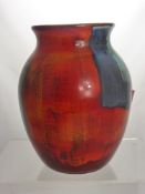 A Poole Pottery Vase Ceramic with blue and red glaze and factory marks to base, approx 27 cms high.