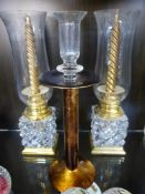 Two Cut Glass and Brass Storm Candle Lamps, 32 cms together with a single glass candle lamp (3).