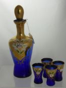 A Blue Bohemian Glass Decanter and six glasses.