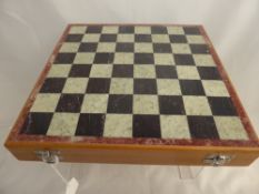 A Stone Inlay Chess Set Box having inlay top with stone carved pieces.