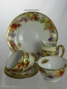 A Continental Porcelain Tea Set comprising nine teacups, nine saucers, nine cake plates, one