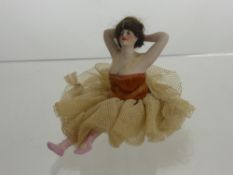 1920's German Bisque Bathing Beauty, depicted seated with arms held aloft, complete with period