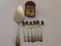 A Set of Six 800 Stamp Silver Coffee Spoons, together with cake slice, 9 ct Xerox Tie Pin.