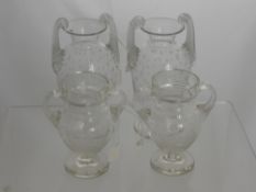 A Pair of Glass Vases with hand blown handles and etched with stars together with a pair of vases