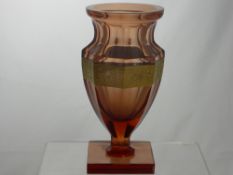A Moser Karlsbad Gilded Glass Vase, the vase of apricot colour has faceted shoulders and body