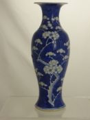 A Chinese Blue and White Ballister Vase, double rings to base and decorated with cherry blossoms,
