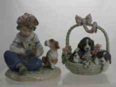 A Lladro Figure of Spaniels, impressed marks to base .13 J, together with a figure of a young boy