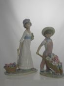 A Lladro Figure of a Young Girl Pushing a Wheelbarrow of Flowers, impressed marks to base G - 24