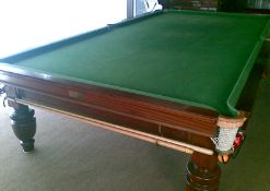 A Thurston & Co Full size Snooker Table with spare new baize. Light, Balls , Scoreboard etc.