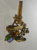 A Brass Sextant, stamped Elliott Brothers, with various coloured lens.