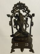 A Circa 19th Century Sino Tibetan Seated Figure of a Buddha.  The figure resting on lotus form