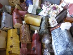 A Large Collection of Pottery Cottages, including Wade, Mudlenen Studio, Heritage Houses,