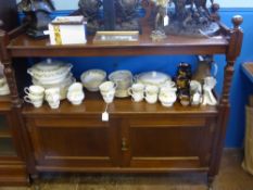 An Edwardian Mahogany Buffet, the buffet having a carved floral top with carved pillars and