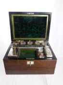 A Rosewood Ladies Vanity Box with fitted interior comprising three glass jars, five cut glass