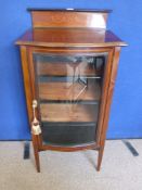 An Edwardian Style Music Cabinet, with decorative inlay on tapered legs with three internal
